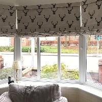Handmade pattern matched Roman Blinds in a Bay Window