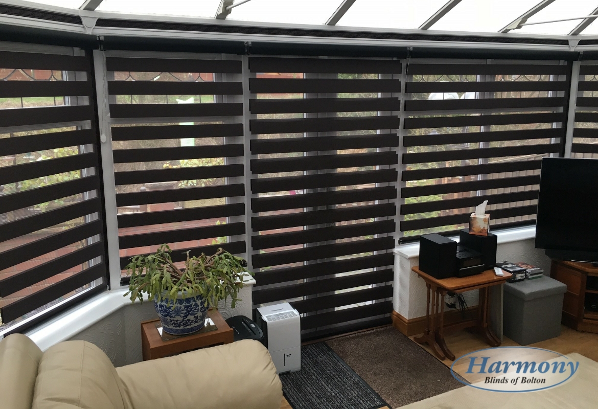 Black mirage day and night blinds in a conservatory open position