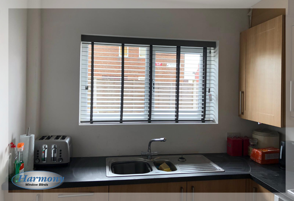 Taped Wooden Venetian Blinds In A Kitchen