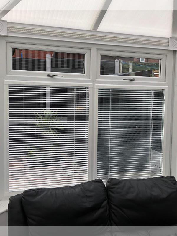 White Perfect Fit Venetian Blinds in a Conservatory